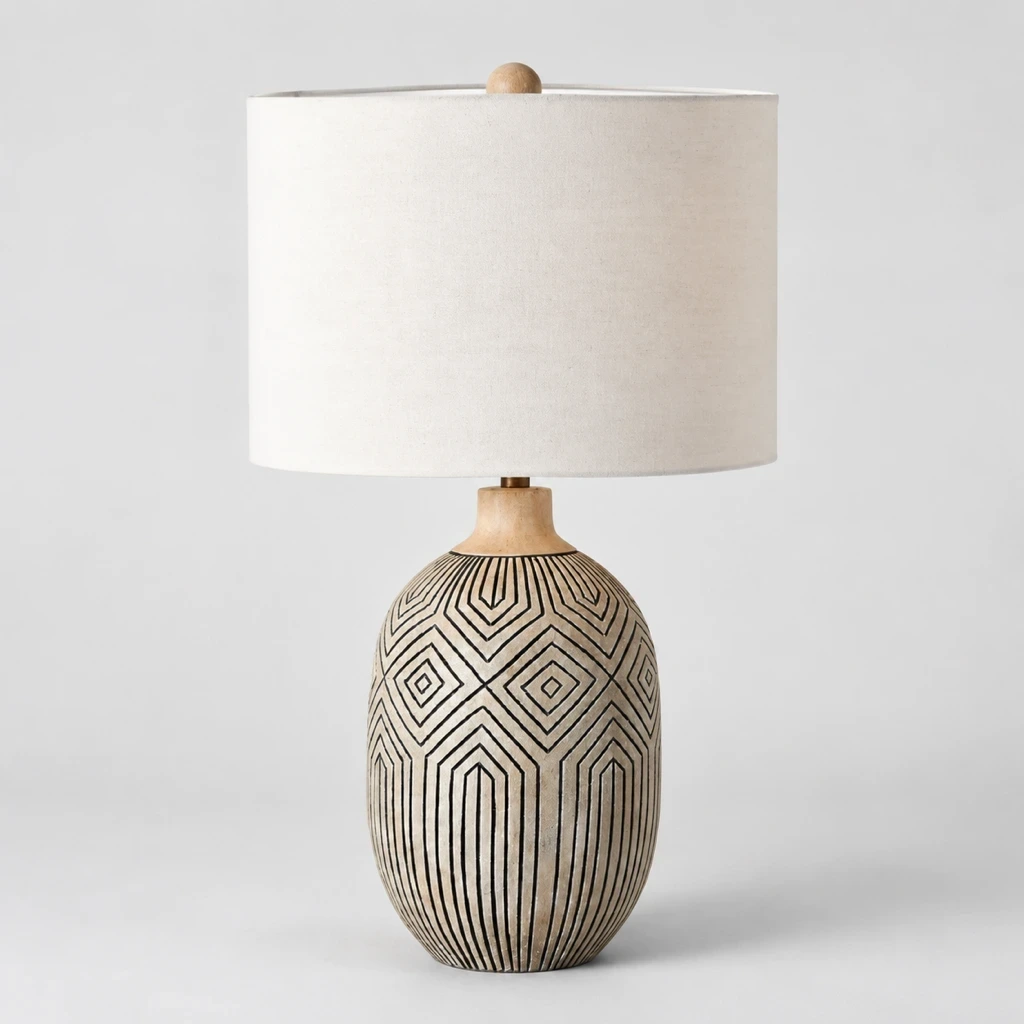 Merritt Bohemian Carved Wood Table Lamp switched off in a neutral studio