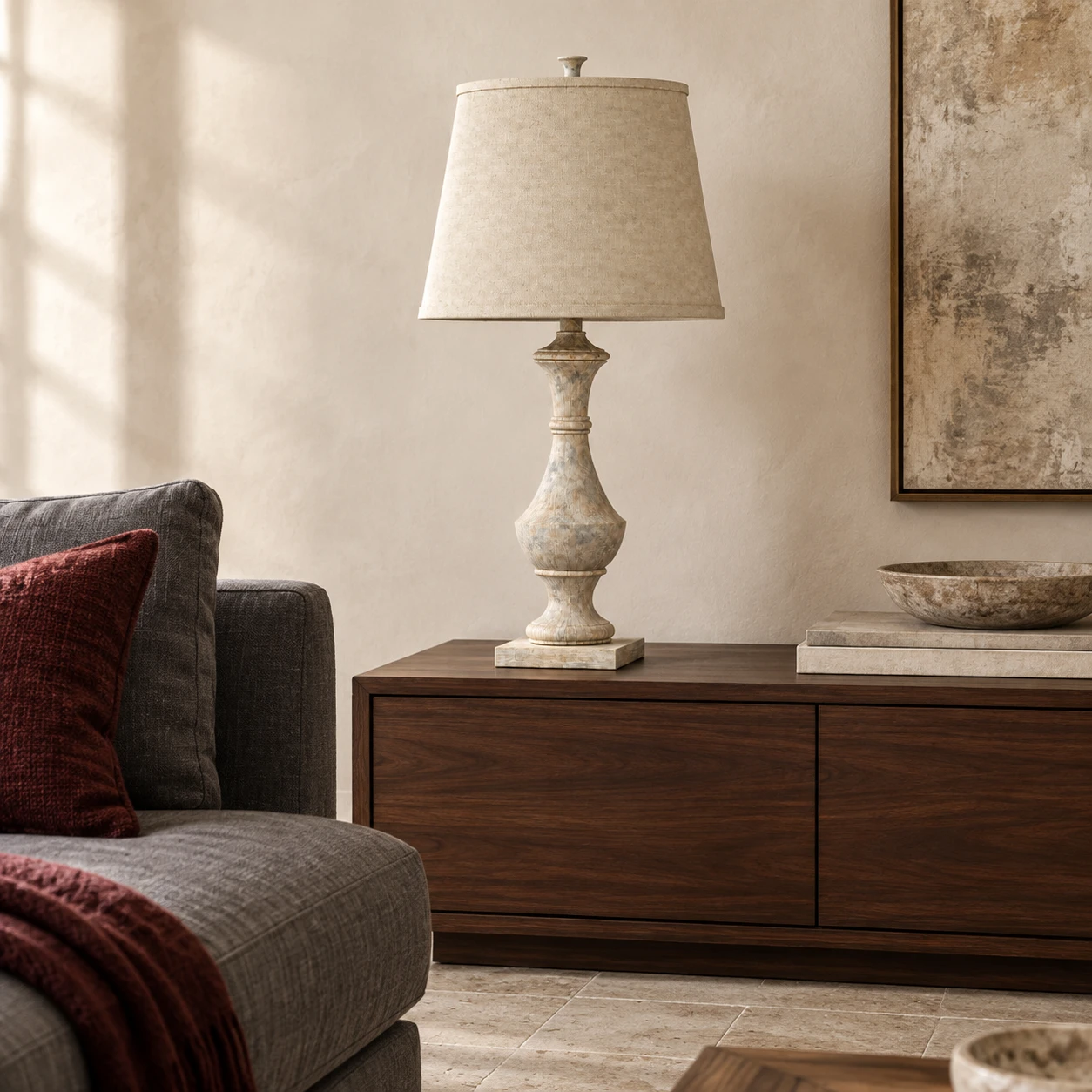 Carved wood table lamp on a walnut living room console