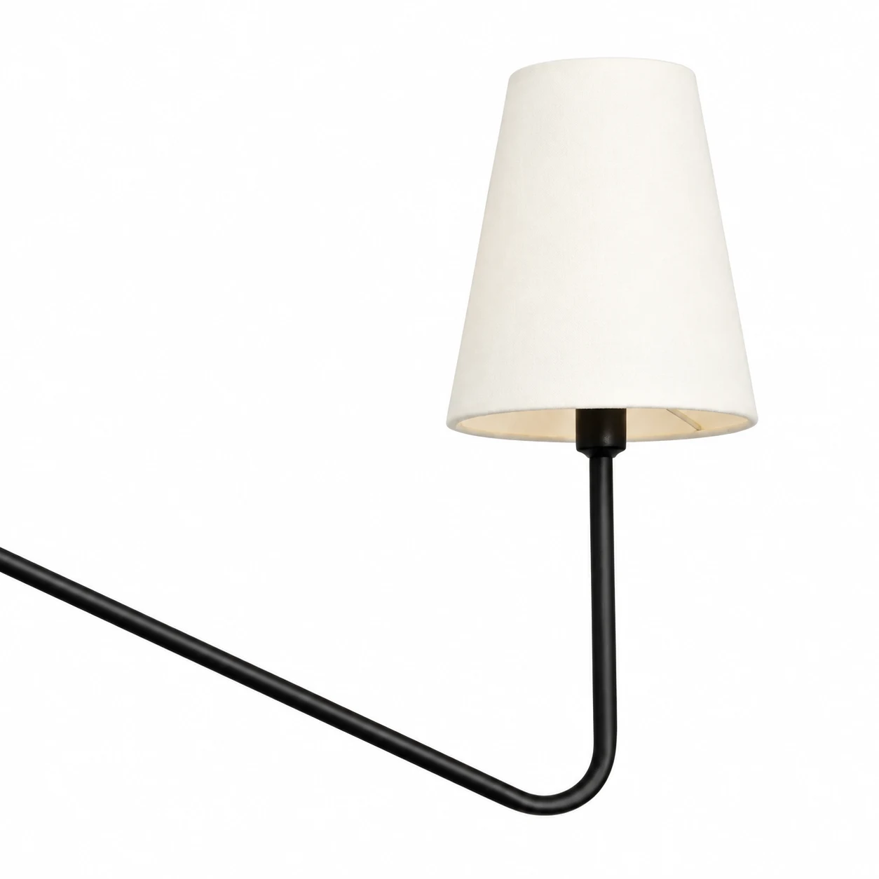 Close view of the white tapered fabric shade and rounded black outer arm