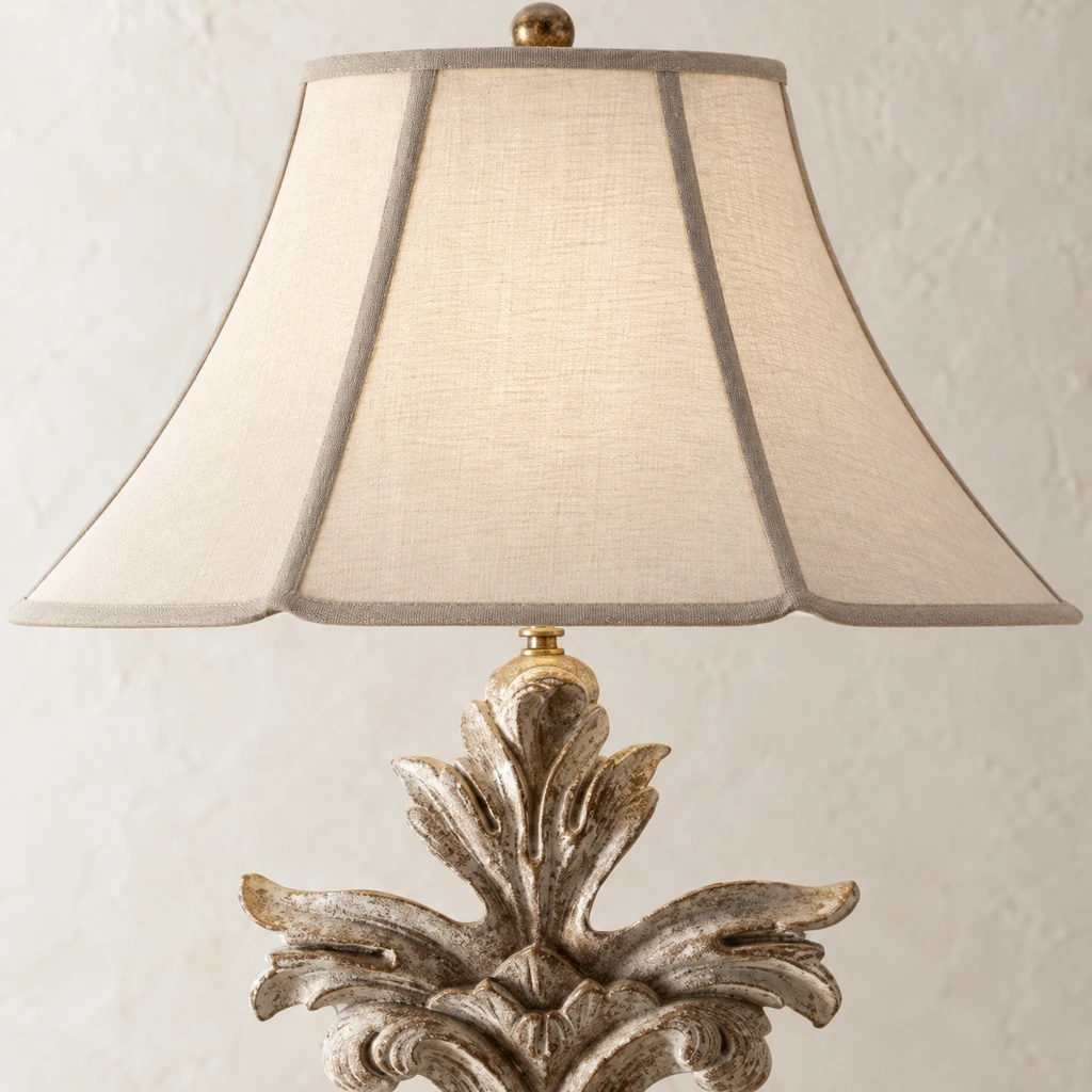 Close detail of the tapered ivory fabric shade and trim