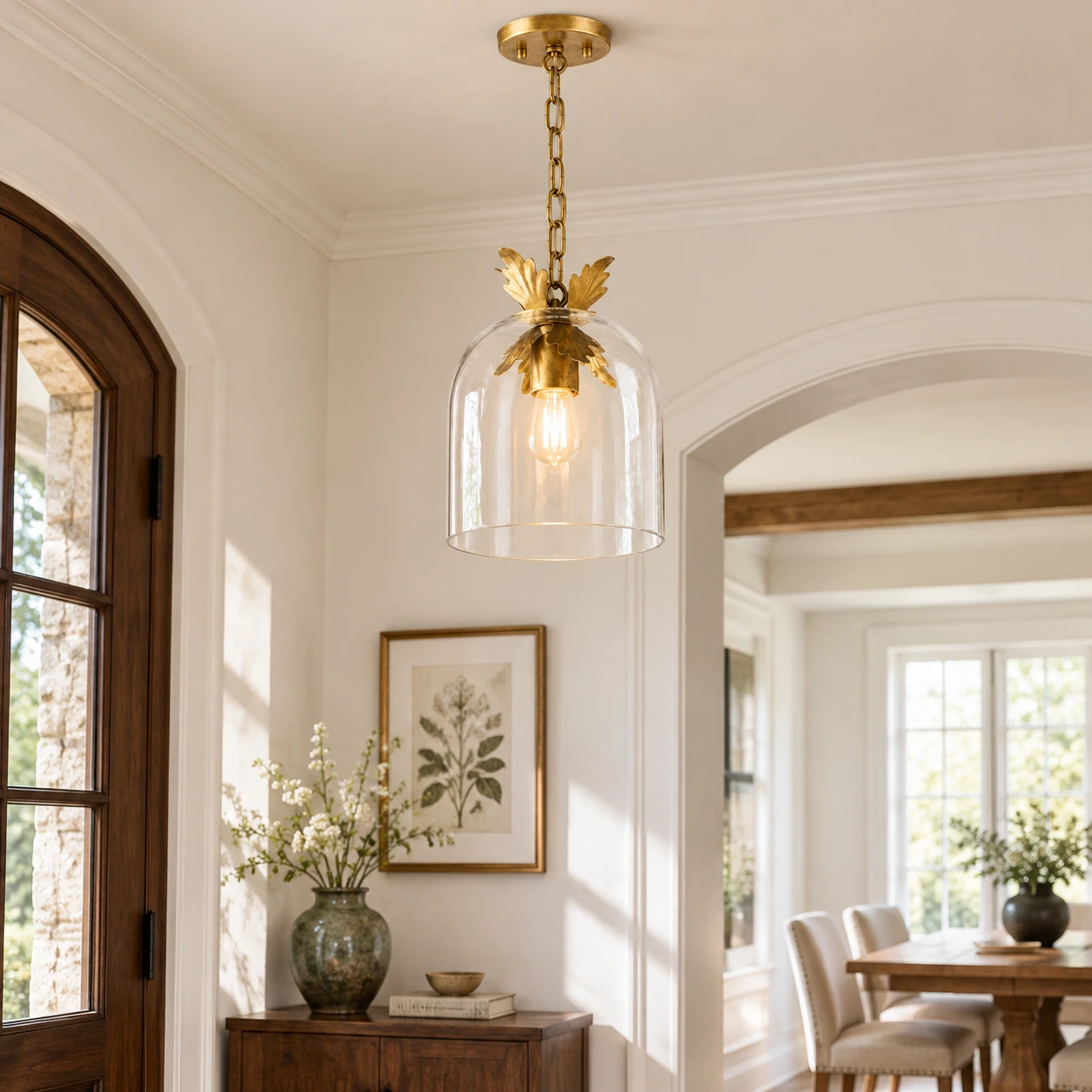 Clara clear glass pendant with leaf-trim fitting in a rustic entryway