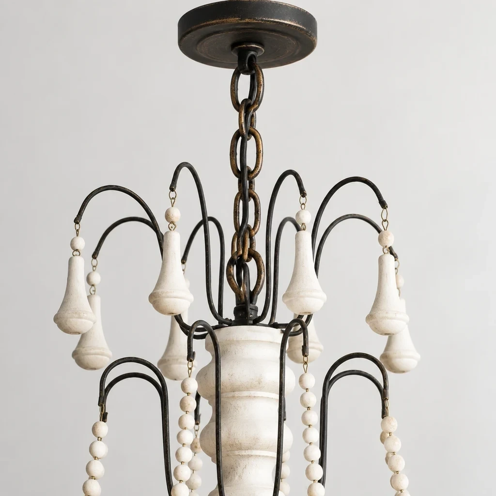Close detail of the white turned wood crown, ceiling canopy and chain