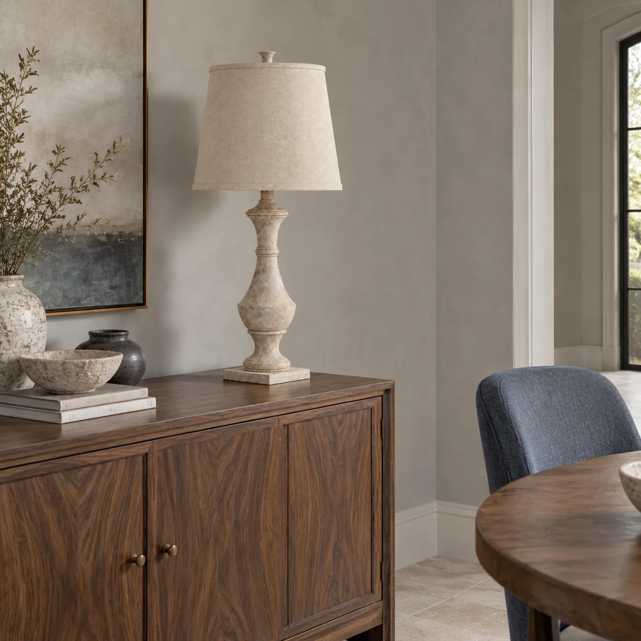 Carved wood table lamp on a dining sideboard