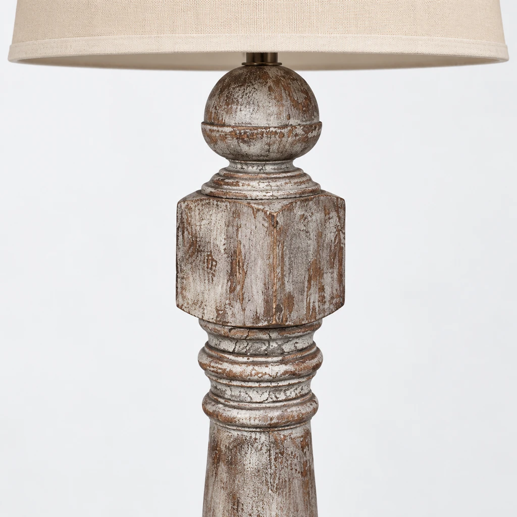 Close detail of the distressed turned wood column