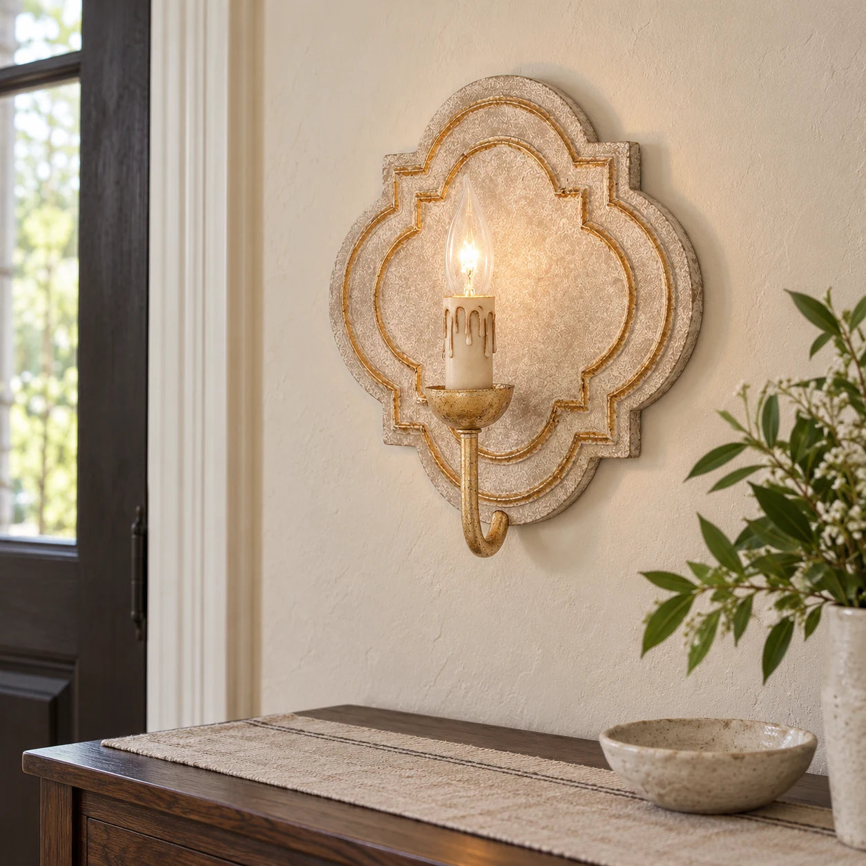 Nola wood wall sconce above an entry console