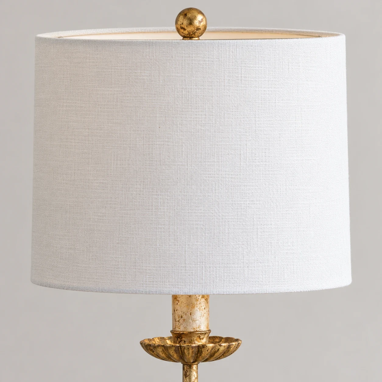 Close view of the fabric shade and ball finial on the Clove table lamp