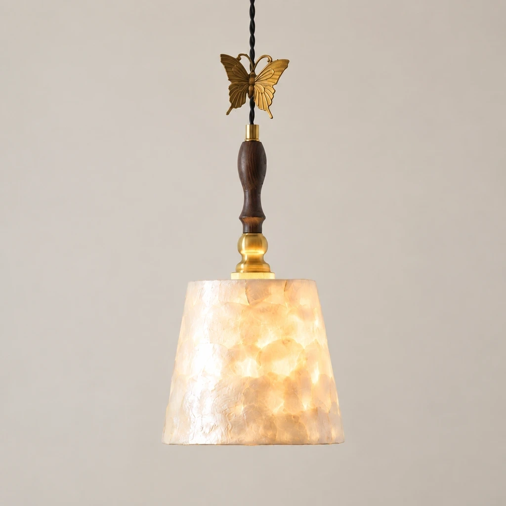 Elena Vintage Butterfly Shell Wood Pendant Light switched on in a neutral studio