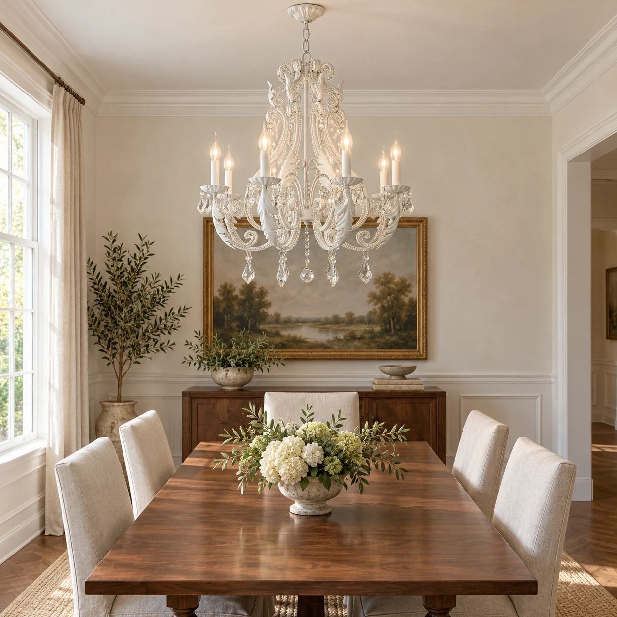 Eight-light Camille chandelier over an ivory American dining table
