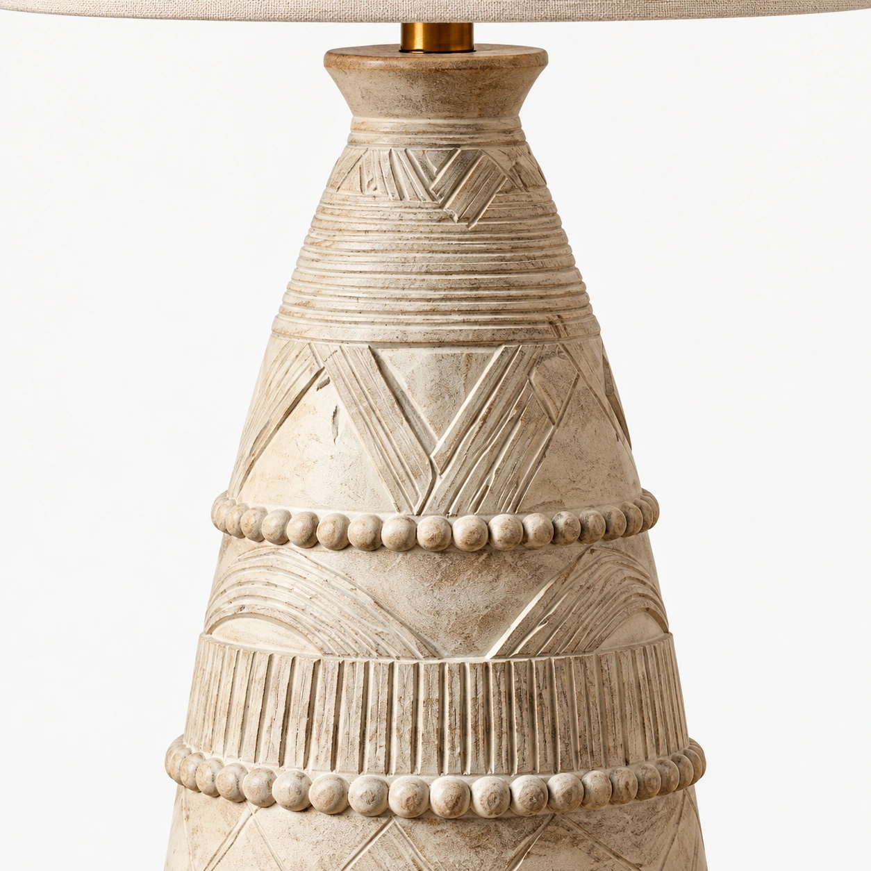 Close view of the carved ivory wood base on the A table lamp