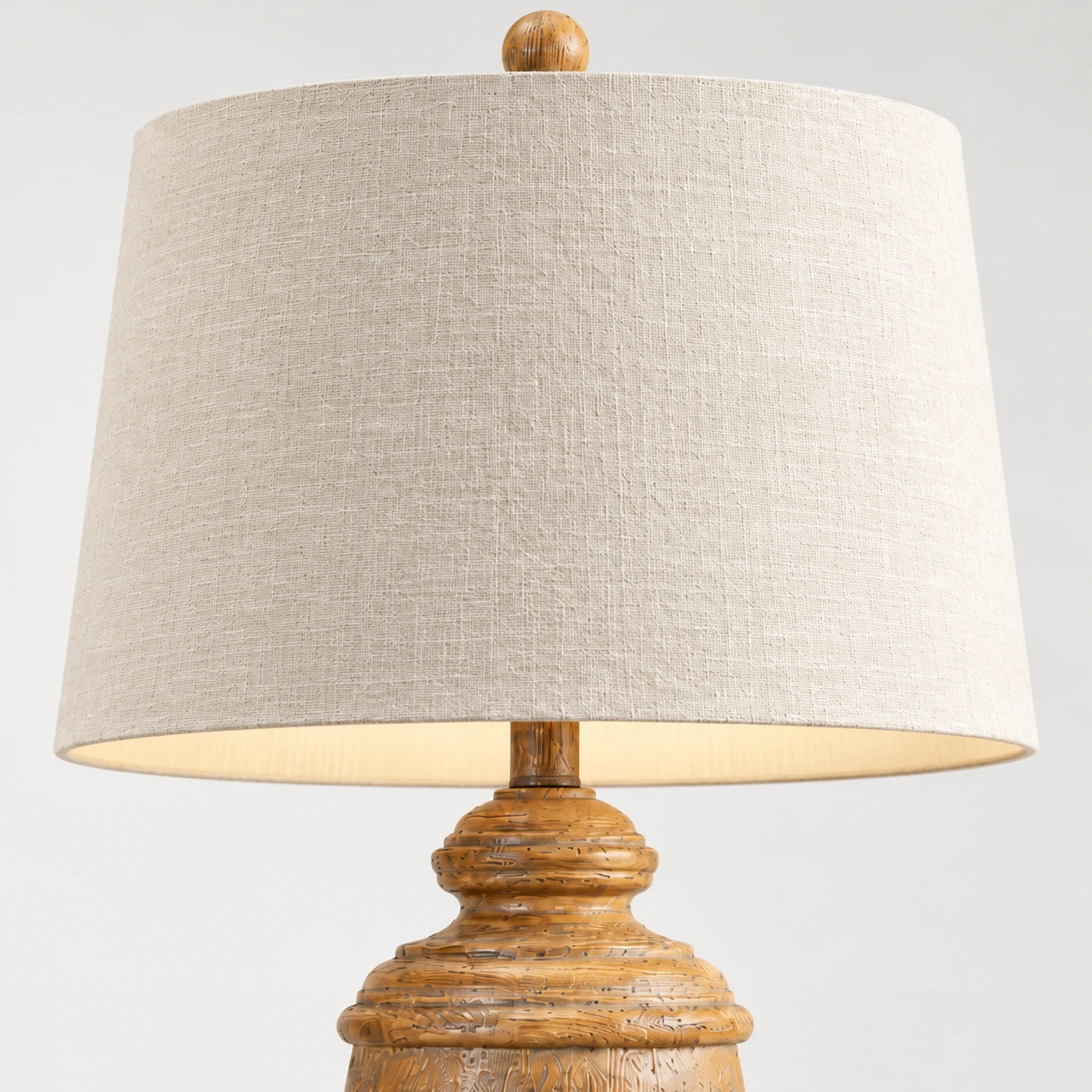Close detail of the cream fabric drum shade