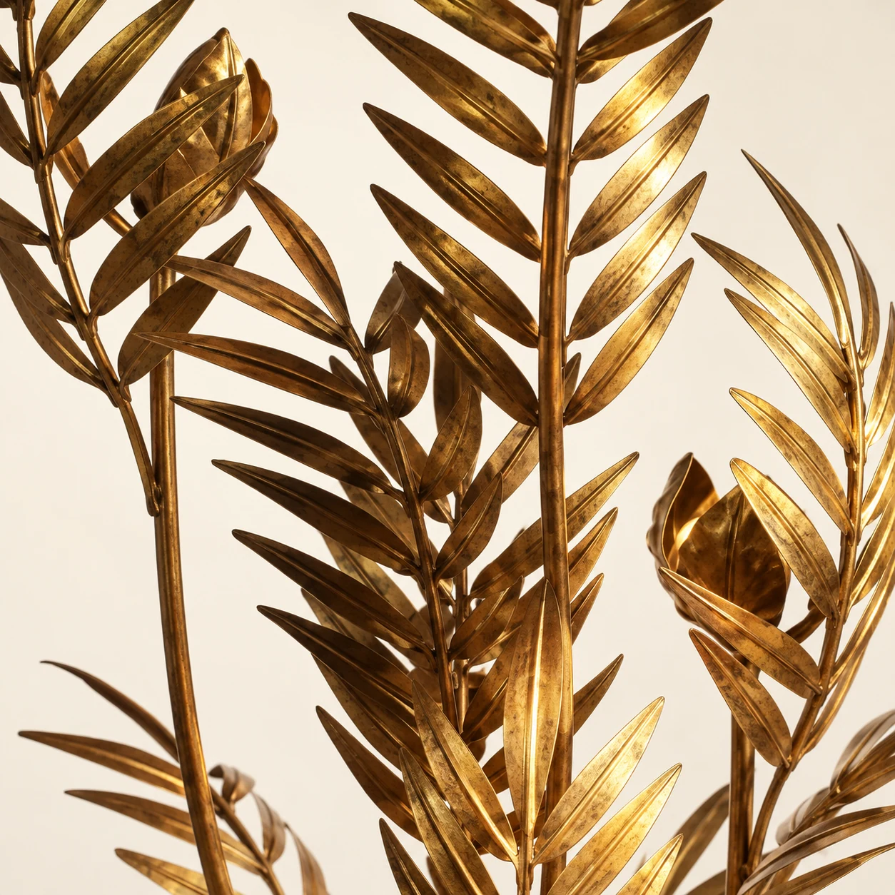 Close detail of iron palm leaves on the Liora floor lamp