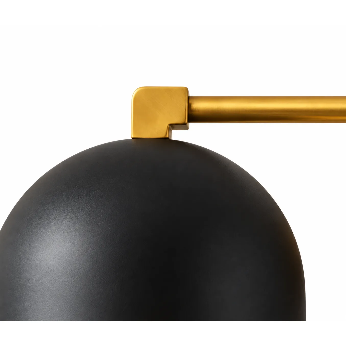 Close view of the brass bar joint between the dome and the backplate
