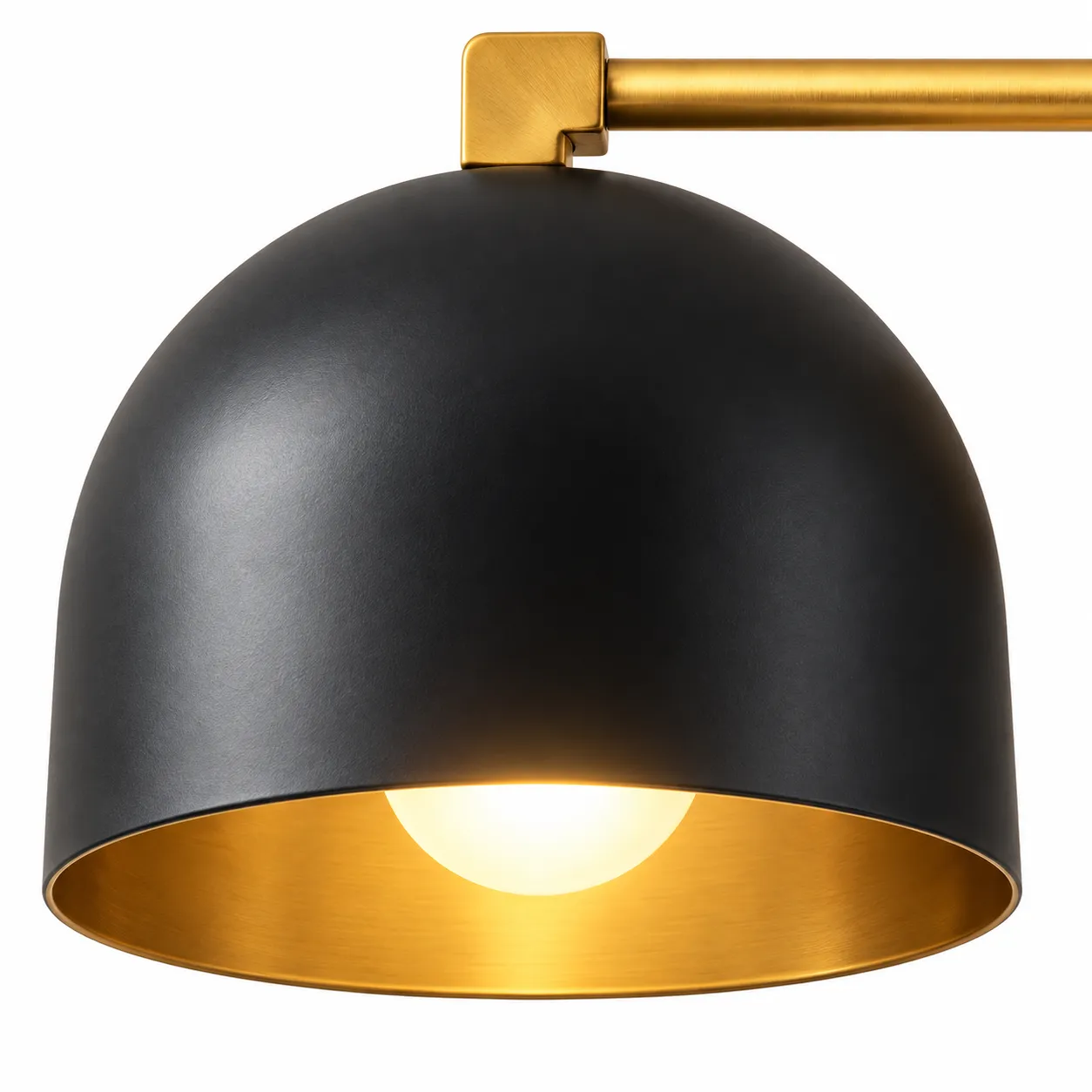 Close view of a deep black metal dome with the bulb inside