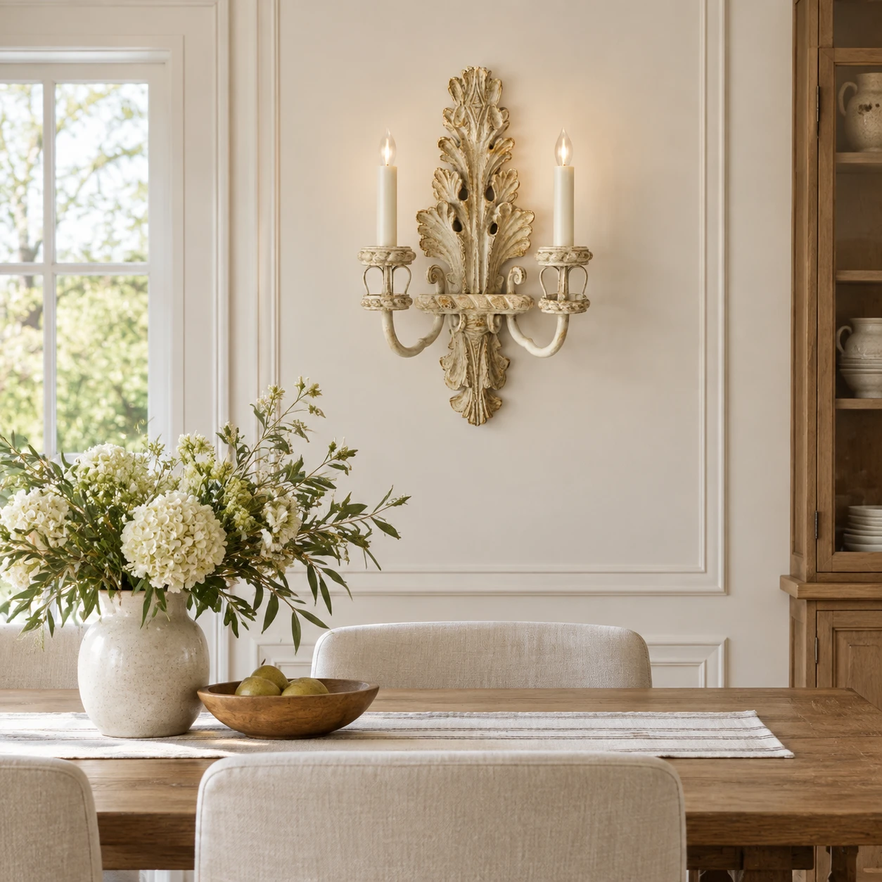 Wood candle wall sconce installed in a dining room