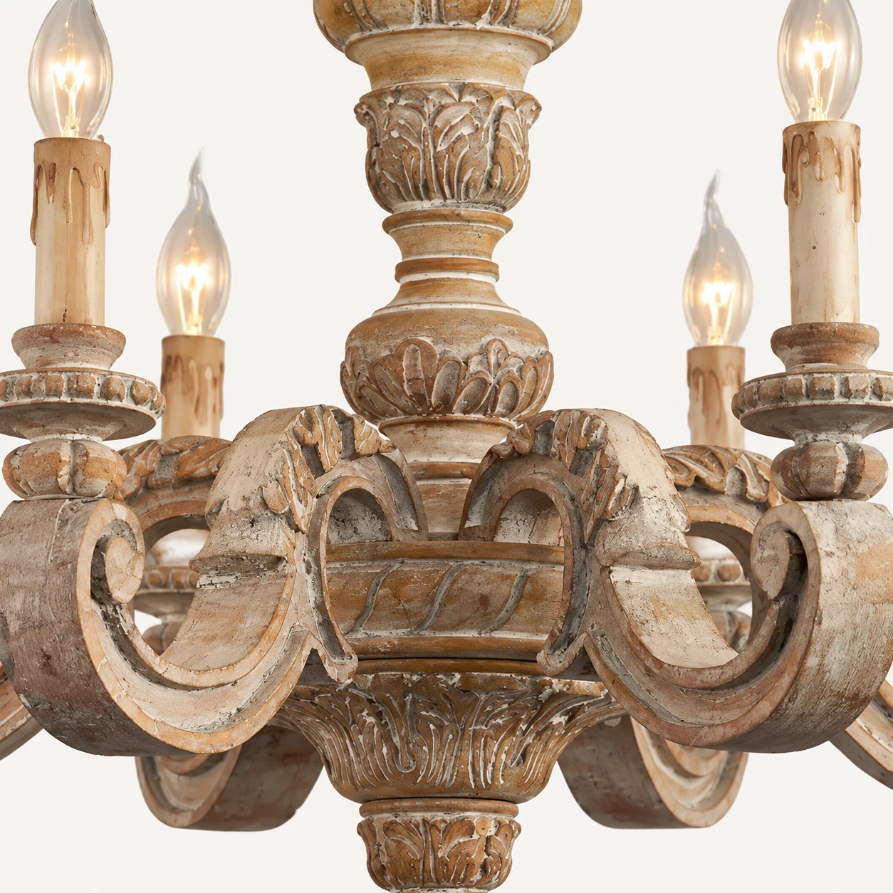 Centre en bois ancien sculpté et détails des bras en volute