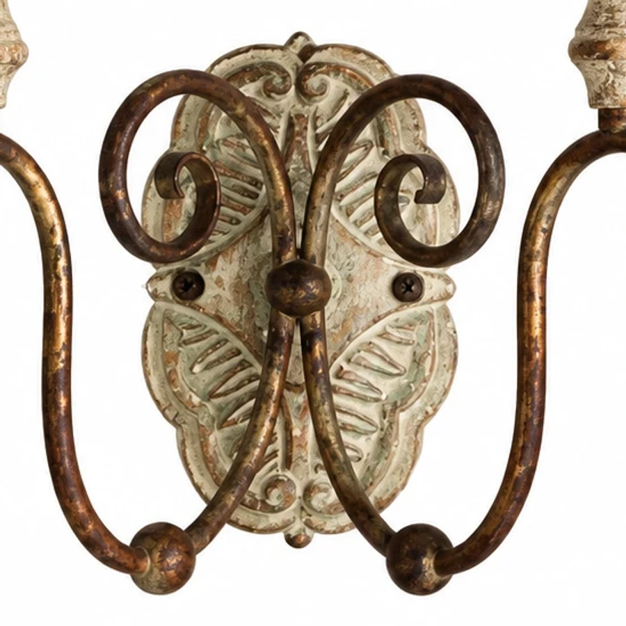 Close view of carved wood backplate and scrolling iron arms