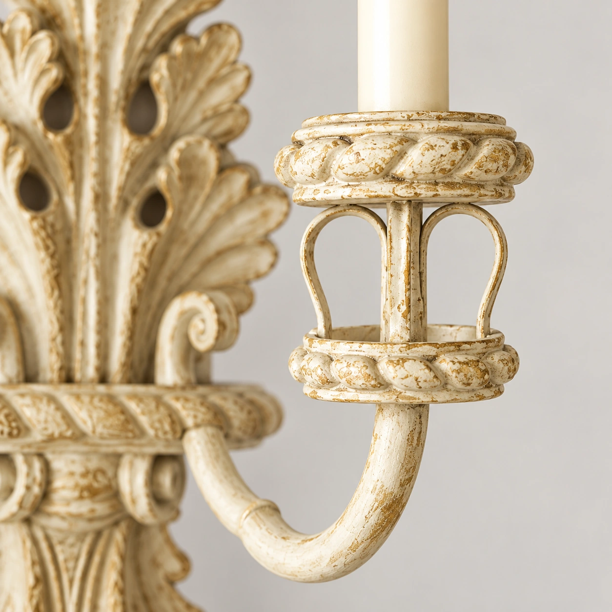 Close view of the rope-edged iron candle cup and curved arm