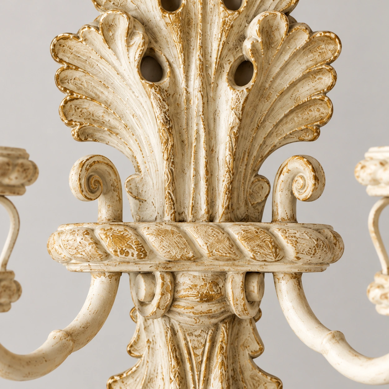 Close view of the carved ivory-and-gold wood backplate